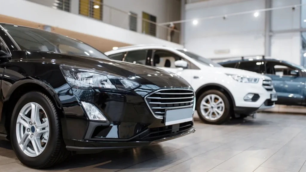 Customer browsing used cars online while comparing options from used car dealerships in Austin.