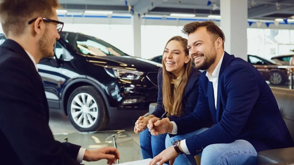 Customer completing paperwork quickly at a car dealership in San Marcos, TX after choosing a vehicle online.